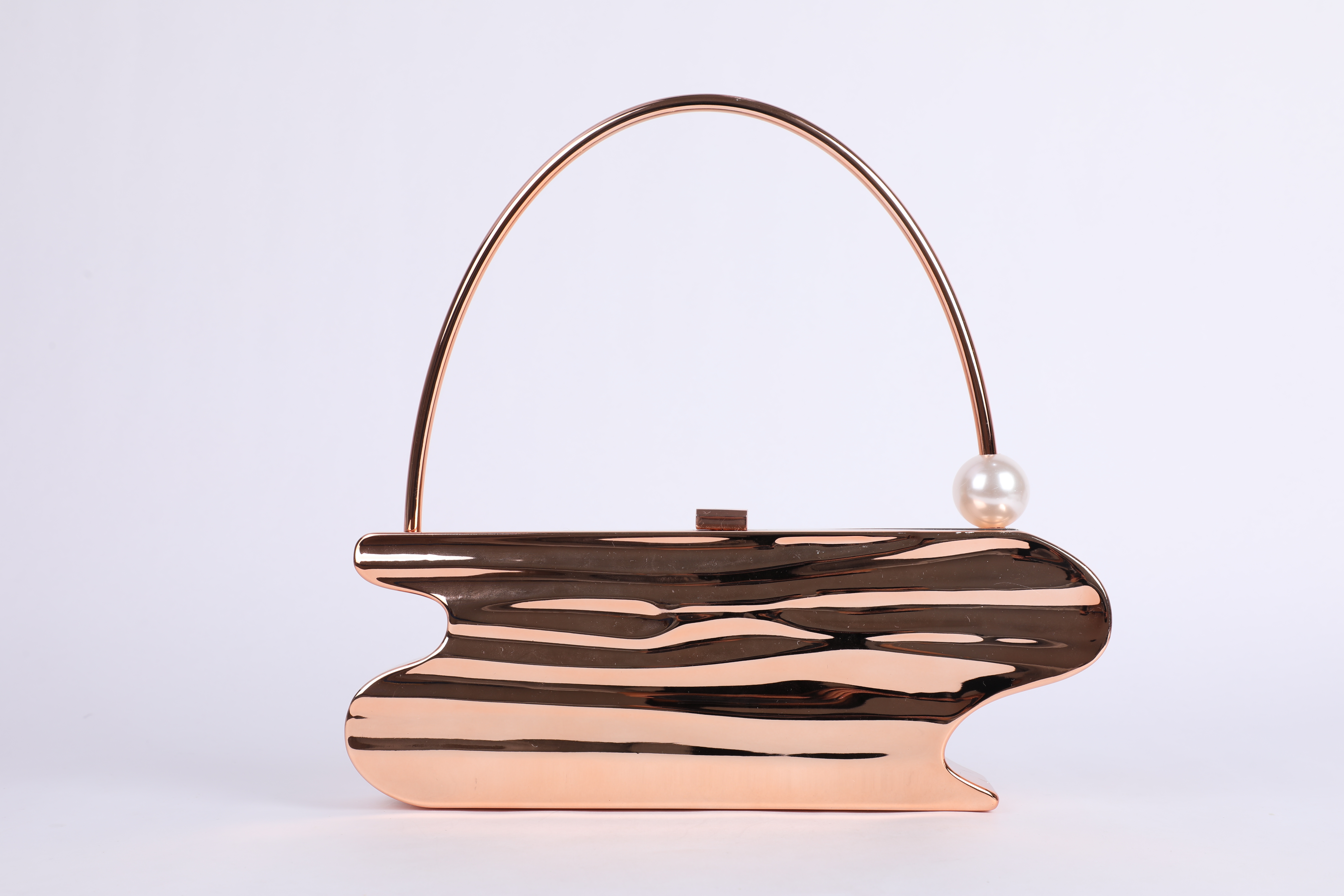 Rose-Gold Flowing Sculptural Evening Bag with Pearl Handle Accent
